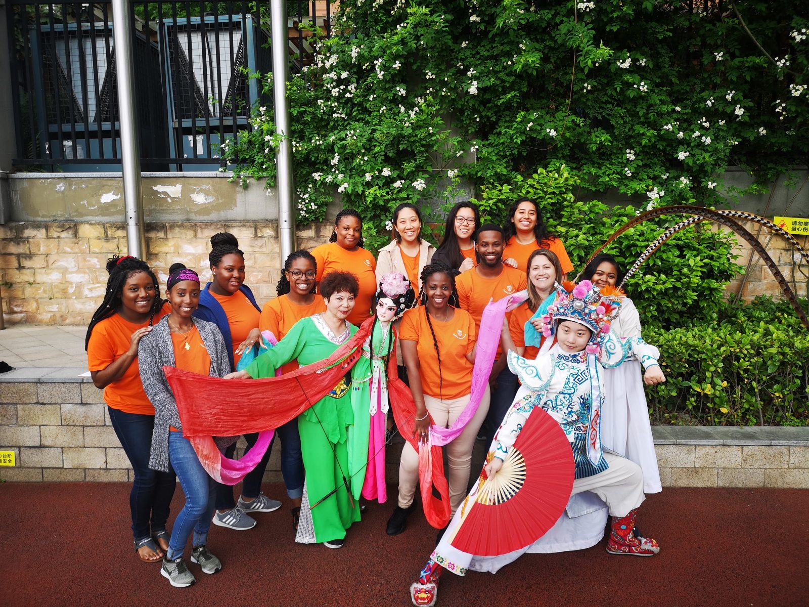 Students posing with Chinese opera costumes